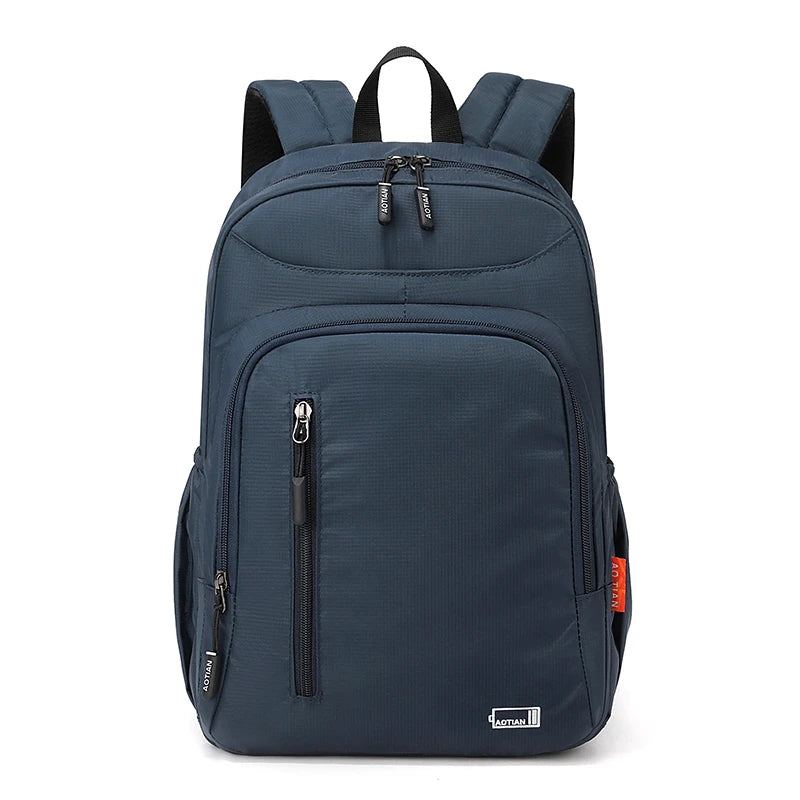 Navy blue fashion commuter daypack for women with black straps and zippers
