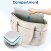 A beige padded laptop compartment in a tote bag protecting a silver laptop.