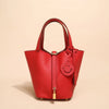 Helles rotes Leder-Bucket-Bag mit gesticktem Smiley-Gesicht