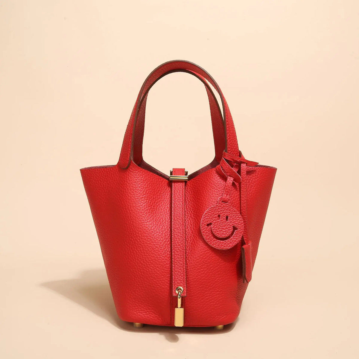 Helles rotes Leder-Bucket-Bag mit gesticktem Smiley-Gesicht