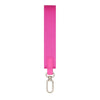 A bright pink nylon wrist strap keychain.
