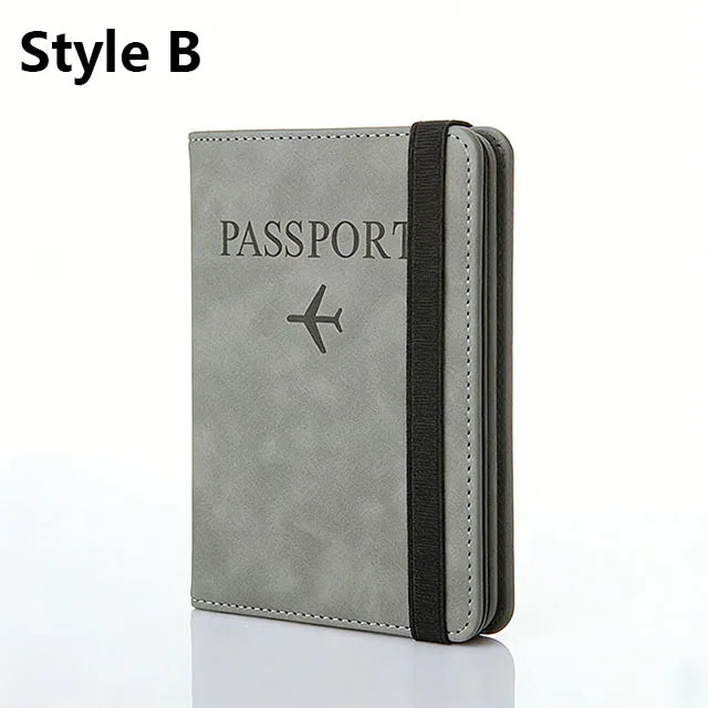 A grey leather passport holder with a black trim and an airplane icon embossed on the cover.