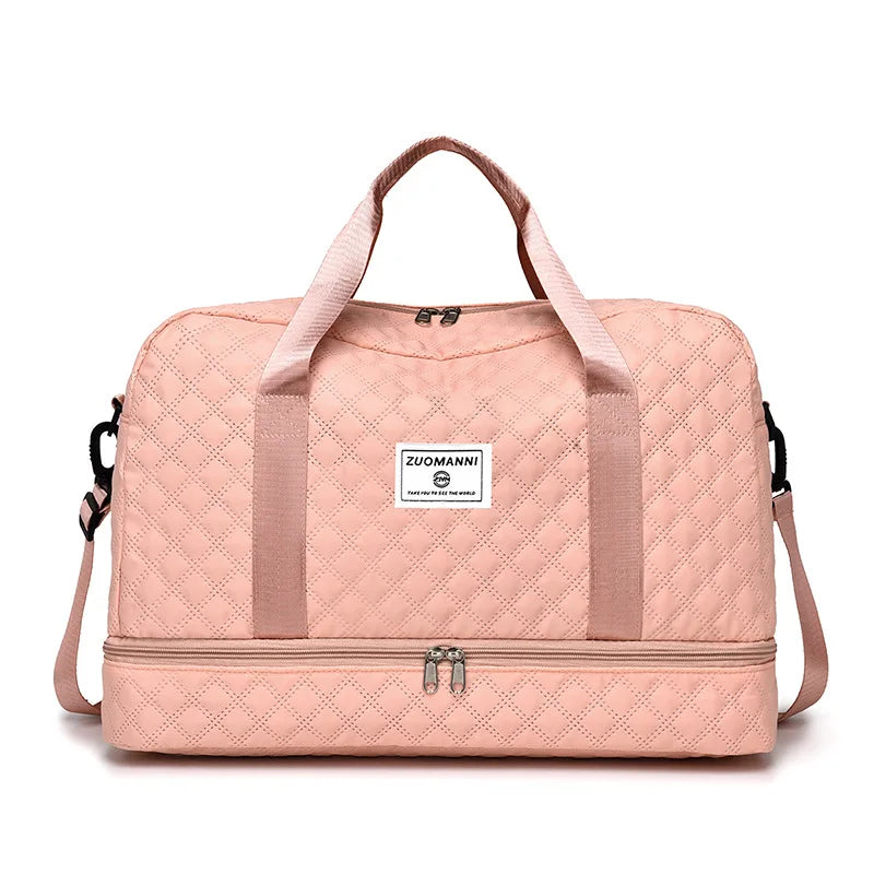 A pink Zuomanni durable nylon travel duffle bag with light quilted texture.
