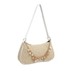A beige straw shoulder bag featuring delicate ocean-themed charms and a white strap.