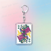 A silver keychain featuring a detailed illustration of Deltarune chibi poker cards.