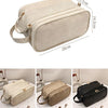 A beige PU leather travel makeup organizer bag shown from the top and side, featuring double zippers.