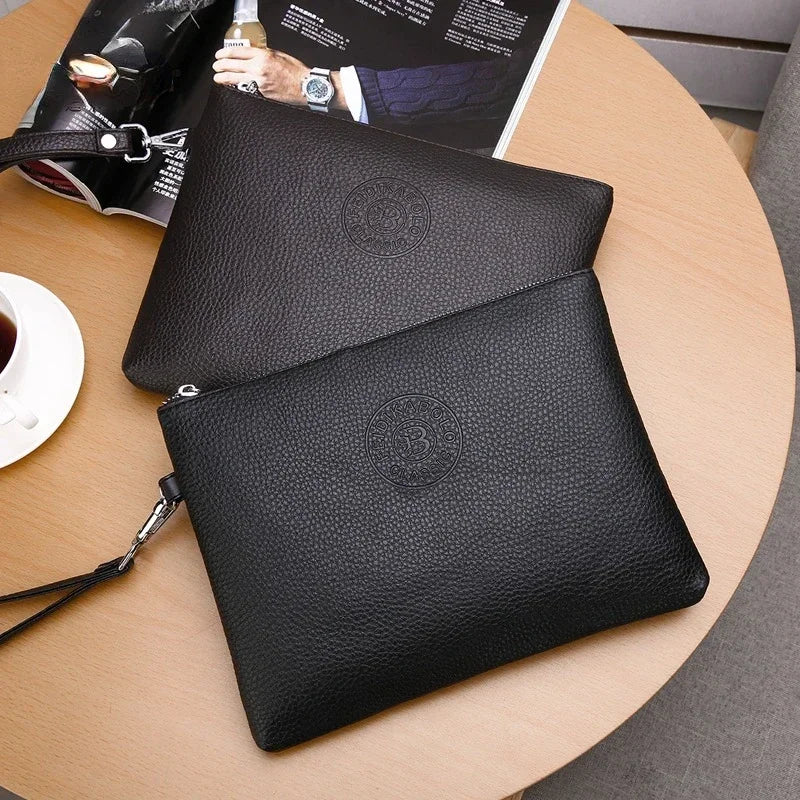 A black elegant PU leather men's clutch wallet resting on a wooden table next to a magazine.