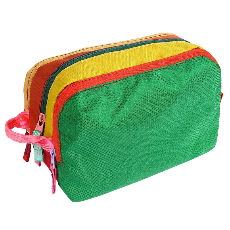 A multi-compartment travel toiletry organizer bag with colorful striped sections in green, orange, and yellow.