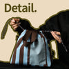 A hand holds a striped insulated lunch bag, demonstrating its drawstring design.