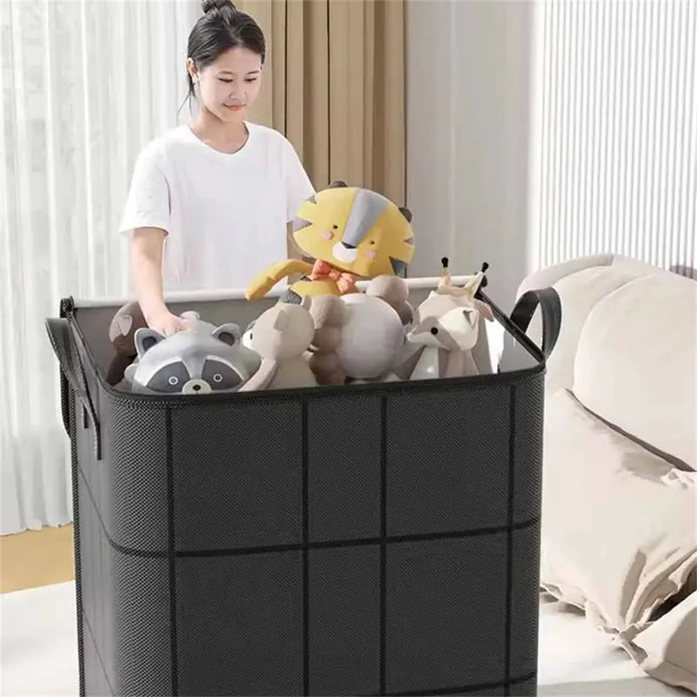 A black foldable non-woven storage bag filled with stuffed animals and a woman standing beside it.