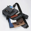 A black nylon crossbody sling bag with multiple compartments and a leather wallet inside.