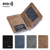 A brown leather bifold wallet with a clear plastic window showing a battery and credit cards.