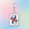 A silver keychain featuring a pixel art design of Deltarune chibi poker cards.