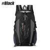 Black waterproof hiking backpack with gray accents and adjustable straps.