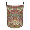 A vintage floral laundry hamper with a red background featuring green and cream foliage patterns.
