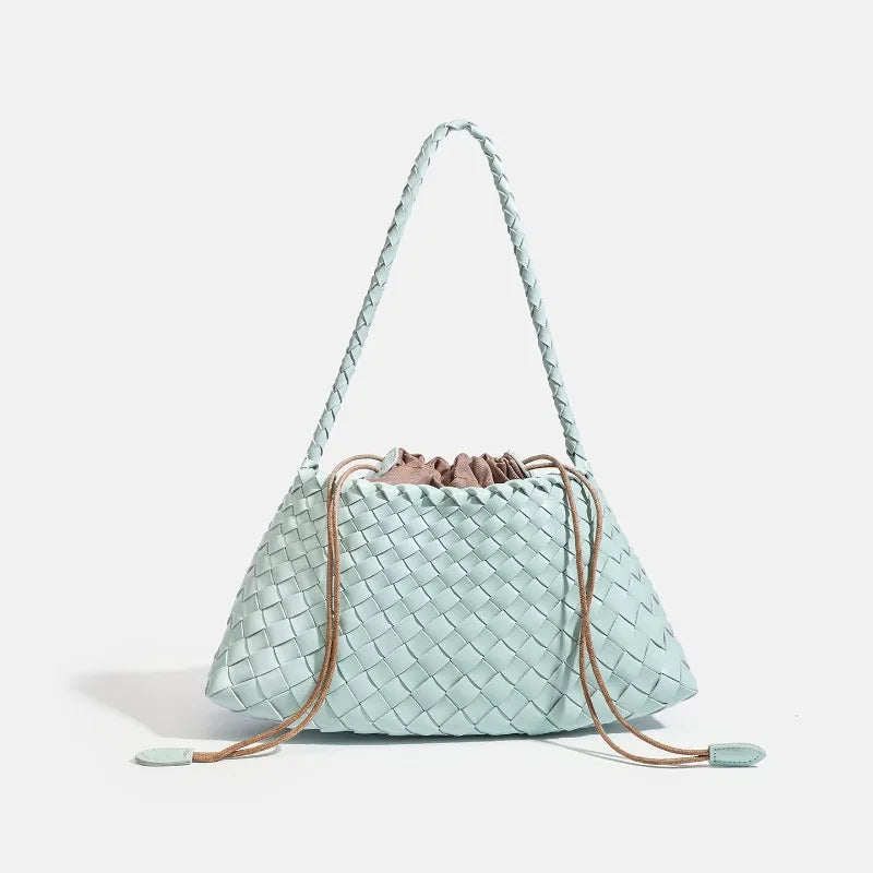 A light mint green handwoven PU shoulder bag with a woven texture and long leather straps.