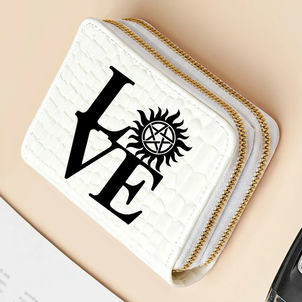A white quilted wallet with gold zipper detailing featuring a black stylized LV monogram print.
