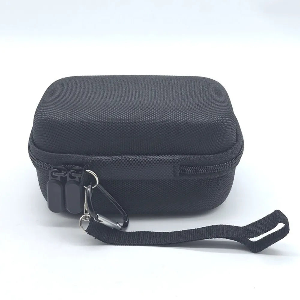 Black durable hard shell case for digital cameras with a black strap.