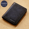 A black DeepBlue leather bi-fold wallet with the name Ciephia resting on a light tan surface.