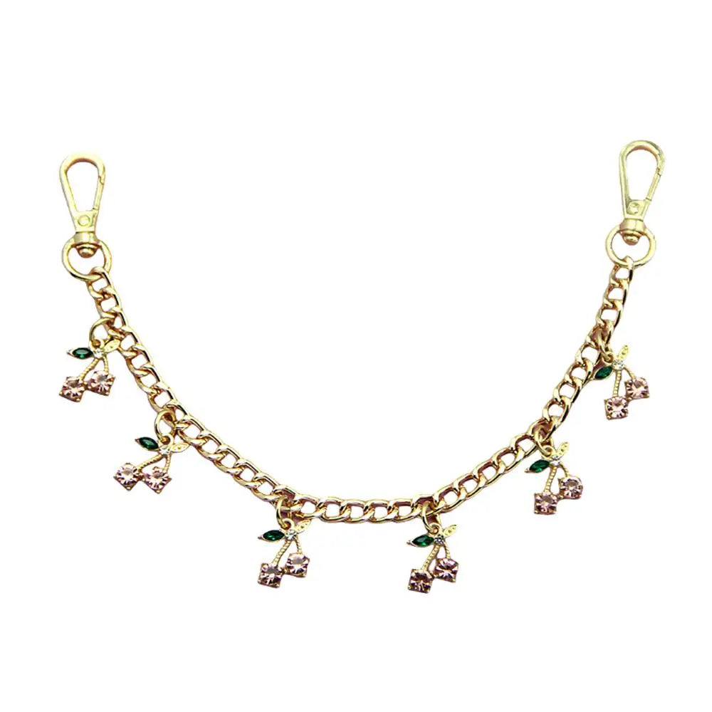 Gold decorative chain with small leaf pendants used for bags and clothing