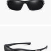 Gafas deportivas polarizadas negras mostradas en una foto de producto.