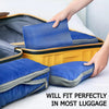 A hand places a blue compression packing cube into a yellow suitcase, demonstrating the fit of reusable packing cubes in lugg