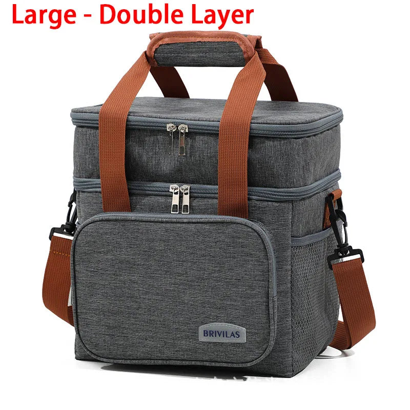 Large double layer insulated lunch bag in gray with brown straps and a collapsible design.