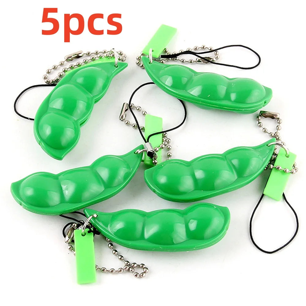 Five green oval shaped stress relief fidget toy keychains with metal chains
