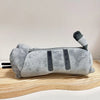 A soft gray plush pouch shaped like a cat with black accents, used for storing anime figures.