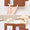 A brown leather compact RFID-blocking wallet is shown open, displaying credit cards and a coin pouch.