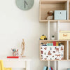 A wooden shelf unit displaying various items including a clock, a stuffed animal, and a fabric storage basket.