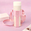 A pink crossbody sling water bottle bag with a white bottle and pink strap is displayed on a light purple background.