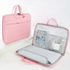 A pink laptop sleeve with a padded compartment and a separate mouse is shown on a white surface.