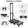 A black heavy duty folding hand truck with a telescoping handle, rope, plate, and dual ball bearing wheels.