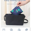 A dark blue foldable carry-on bag is shown being held by a hand, emphasizing its easy folding and portable features.