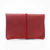 A deep burgundy minimalist full-grain leather passport holder and card wallet.