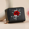 Black faux leather zipper wallet featuring a red rose and script design on the front