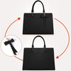 A black premium PU leather laptop tote bag with a handle and a bow detail.