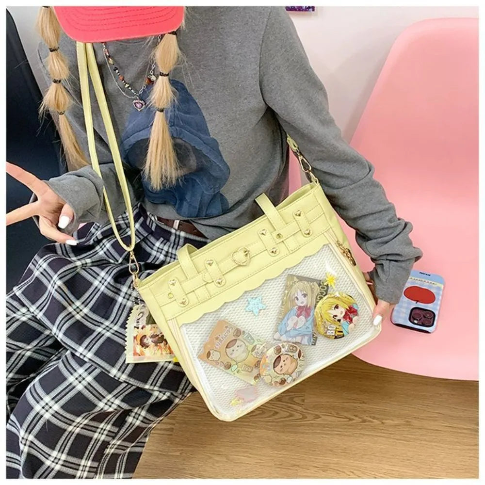 A person wearing a gray jacket and plaid skirt holds a light yellow Y2K punk goth crossbody bag decorated with charms.