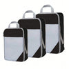 A set of black and white fabric storage organizers with handles.