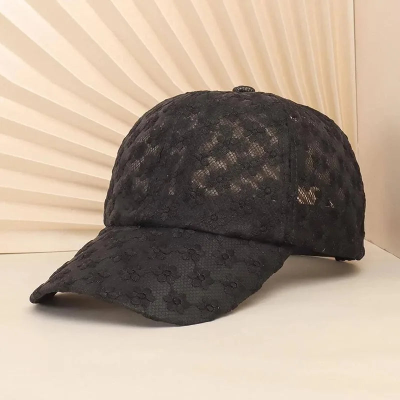 Black summer floral mesh snapback baseball cap shown on a light background.