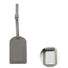 A rectangular gray PU leather luggage tag with a metal clip attached.