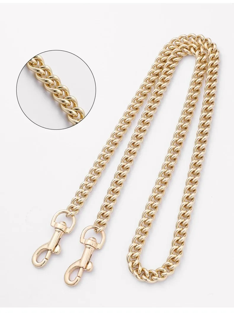 A close-up view of a gold chain bag strap for handbags and crossbody bags.