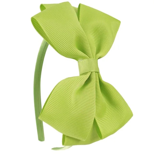 A bright lime green satin bow headband shown against a white background.