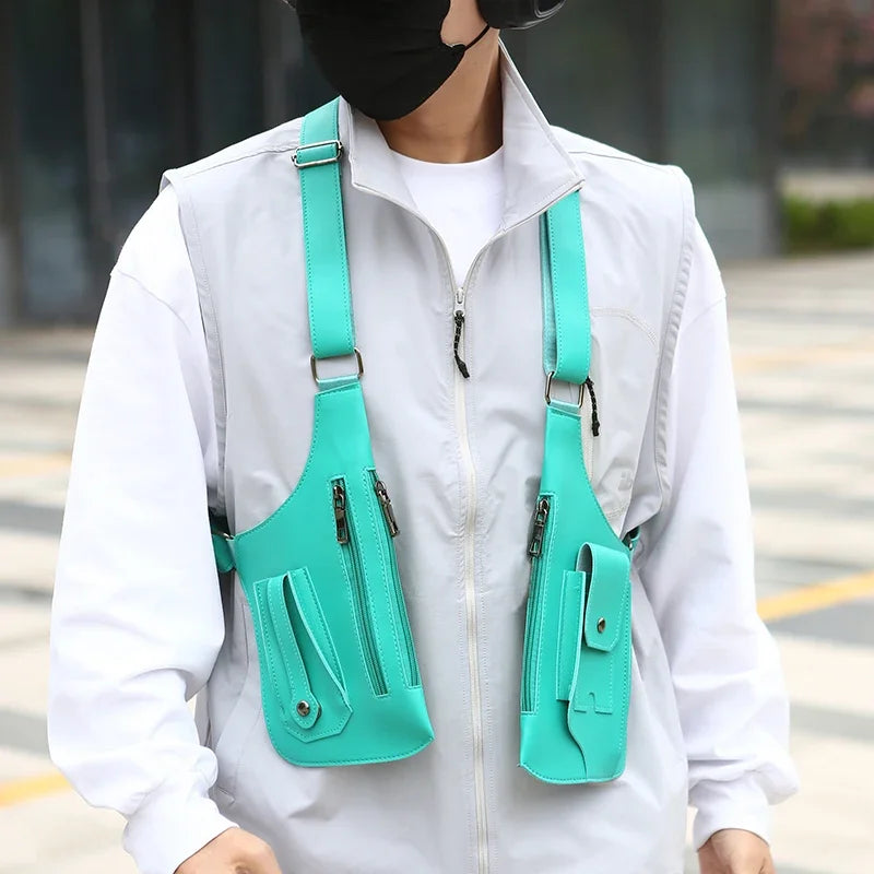 A person wearing a white shirt and black bandana is carrying a teal tactical chest bag with multiple pockets.