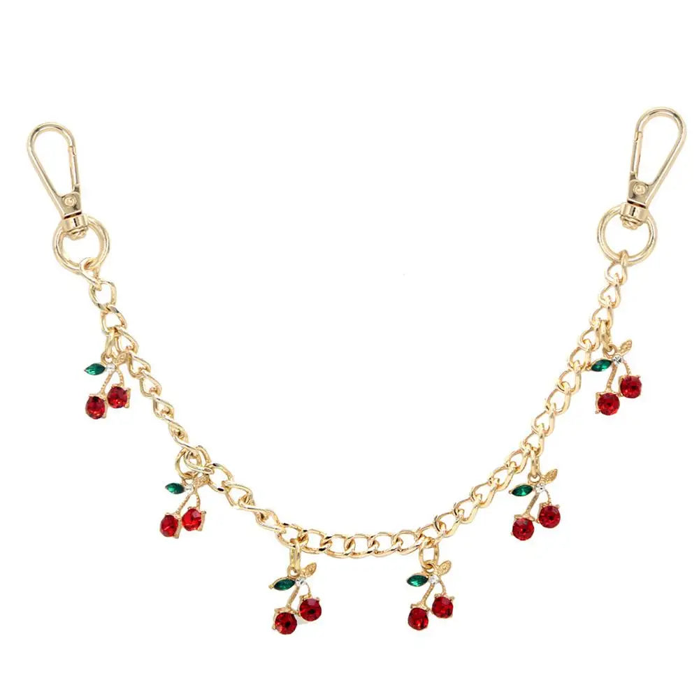 Gold decorative chain with small green and red leaf pendants for bags and clothing