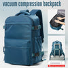 A navy blue vacuum compression backpack with a gray strap and a manual vacuum pump visible.
