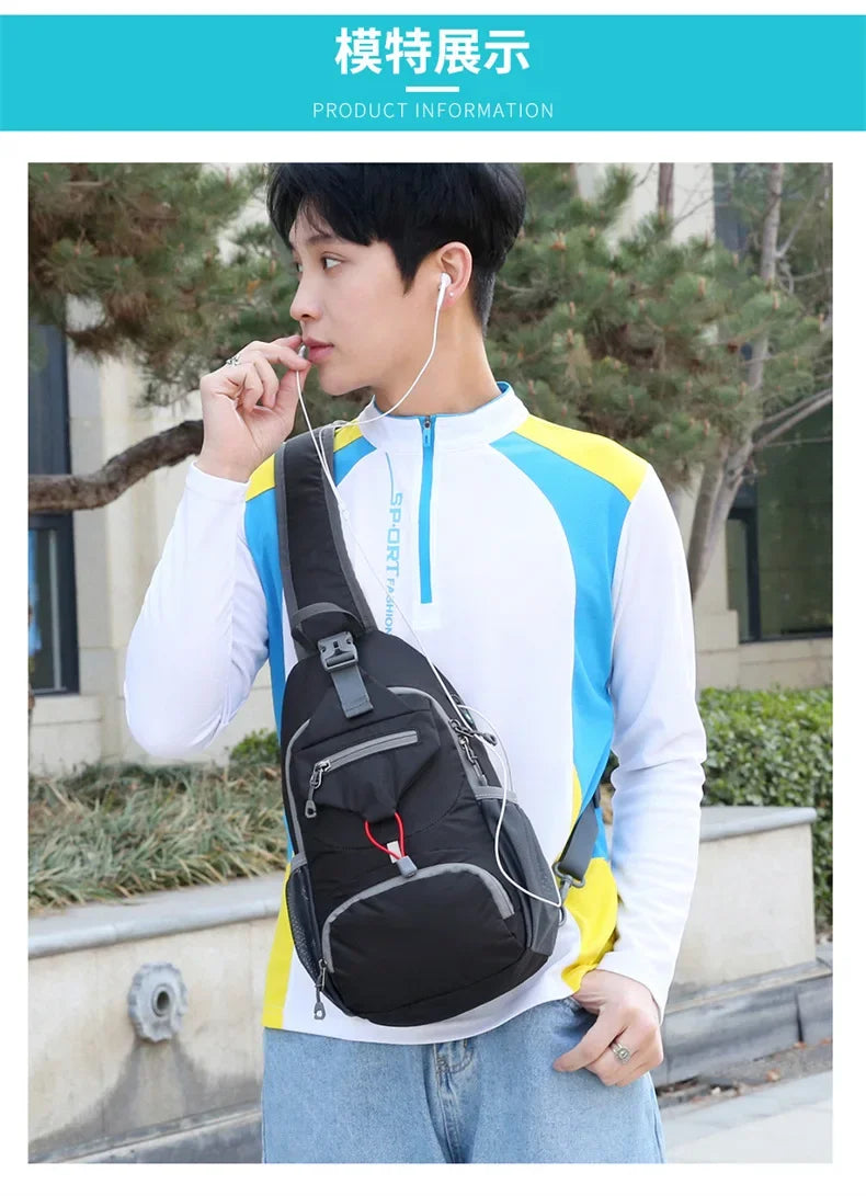 A young man is holding a black nylon chest sling bag while wearing a white long-sleeved shirt outdoors.