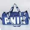 A navy blue Nike backpack with white lettering and black straps is shown against a light gray background.