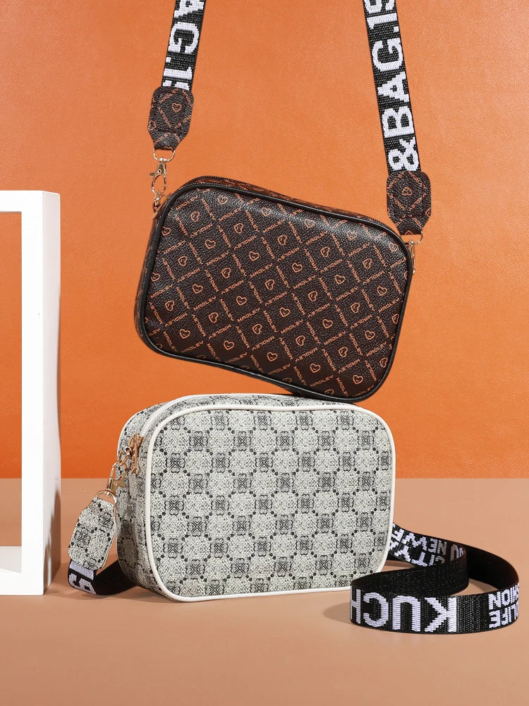 A brown patterned fashion crossbody bag is displayed against an orange background, with a gray patterned bag nearby.